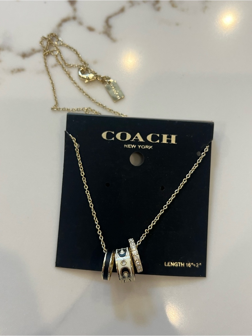 Coach Gold-Tone Ring Pendant Necklace with Crystal Accents